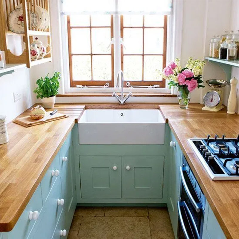 teal cabinets in small kitchen